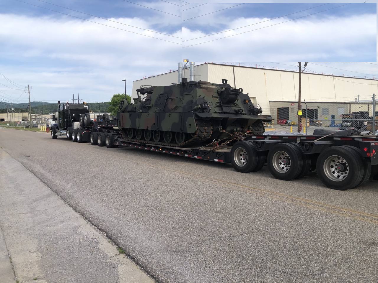 Black Kenworth with military equipment on RGN